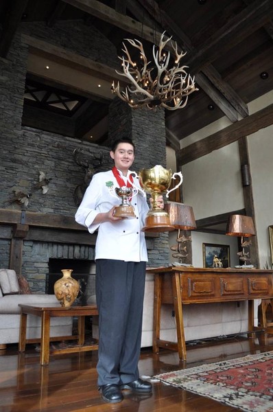 Joseph Clarke holding trophy